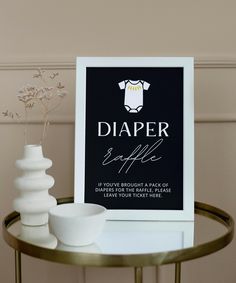 there is a sign that says diaper bottle next to two white vases on a table