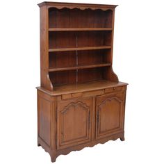 an old fashioned wooden bookcase with two doors