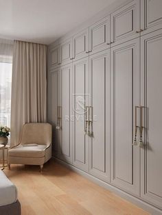 a bedroom with white cabinets and a beige chair