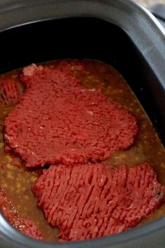 the meat is being cooked in the slow cooker