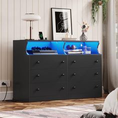 a black and blue dresser in a living room