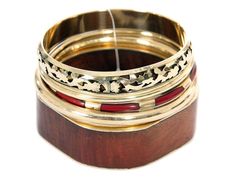 100 Fashion Deals NOT MADE IN CHINA Brown Gold Fashion Bangles Set Brown/Gold #br-2611 Earthy tones 5 piece fashion bangles set includes square wooden bangle with rounded corners, gold & brown 4 bangles each having its own etched design or is plain. Hand crafted beautifully designed costume jewelery set. Product Features: Assorted Designs & Width Brown & Gold colors Wood, Resin, Gold Plated Aluminium Hand Crafted 2.6" or 7 cm internal diameter Made in India item# BR-2611 Material: Wood Condition Adjustable Costume Jewelry Bangle As Gift, Adjustable Costume Jewelry Bangle For Gifts, Vintage Stackable Bangle As Gift, Gold Bangles Set, Modern Bangle, Costume Jewelery, Gold Bangle Set, Wooden Bangle, Bangles Set