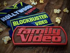 the family video logo is surrounded by popcorn and other items that are scattered around it