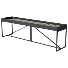 a black table with two balls on it and a wooden board in the bottom half