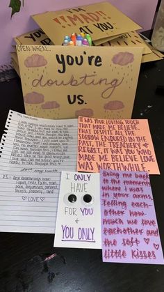 several different types of greeting cards on a table with flowers in the corner and writing on them