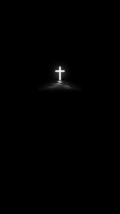 the cross is lit up in the dark