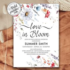 a floral bridal shower party is shown with the words love in bloom on it