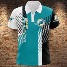 the miami dolphins polo shirt is shown against a brick wall