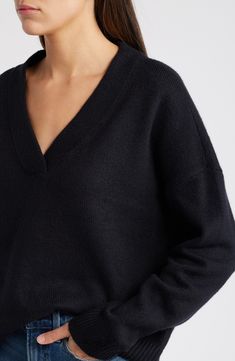 An oversized fit feels so right and relaxed in this V-neck sweater knit from cotton-blend yarn. V-neck Long sleeves Dropped shoulders Ribbed cuffs and hem 56% cotton, 19% acrylic, 18% polyester, 5% nylon, 2% spandex Hand wash, dry flat Imported Winter Relaxed Fit V-neck Sweater, Oversized V-neck Sweater With Ribbed Cuffs, Knit V-neck Sweater With Ribbed Cuffs, Oversized Cozy V-neck Sweater With Ribbed Cuffs, Oversized V-neck Sweater For Fall, Oversized V-neck Sweater With Ribbed Cuffs For Layering, Black V-neck Sweater With Ribbed Cuffs For Fall, Classic Fall V-neck Sweater For Loungewear, Relaxed Fit V-neck Sweater For Fall