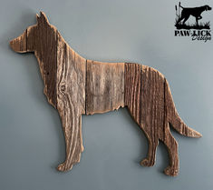 a dog made out of wood is hanging on the wall next to a gray wall