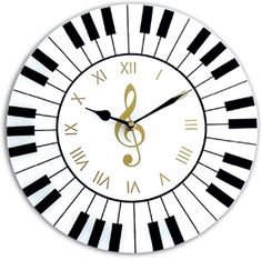 a clock made out of piano keys with a musical note on the front and sides