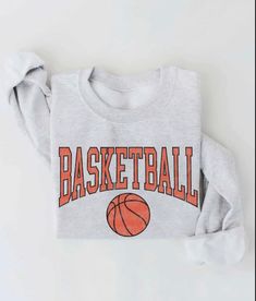 Basketball Graphic Unisex Fleece Pullover Relaxed Fit. -Spun from plush sponge fleece fabric -Remarkably soft unisex pullover -Crewneck sweatshirt lends itself to daily wear and year-round layering. -Featuring ribbed cuffs and waistband, a crew neck, and fashion-forward fleece fabrication. Basketball Board, Sport Fits, Game Day Sweatshirt, Basketball Hoodie, Basketball Sweatshirts, Varsity Sweatshirt, Cute Nike Outfits, Basketball Season, Basketball Clothes