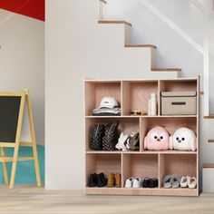 there is a shelf with shoes on it in the room