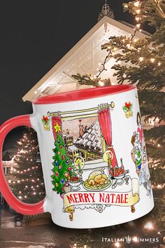 a large coffee mug sitting in front of a christmas tree