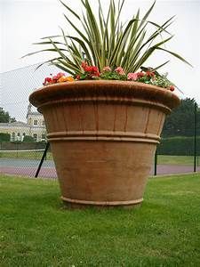 a large potted planter with flowers in it