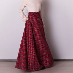 Red plaid skirt: - Side seam pockets - Hidden zipper in the side seam - Separate sash - Classic tartan pattern - Fabric is 40% wool, 58% polyviscose, 2% of elastane Model is 6'2'', she wears US 8 US 0  Bust 82 cm (32.5 inches) Waist 64 cm (25 inches) Hips 89 cm (35 inches) US 2  Bust 85 cm (33.5 inches) Waist 66 cm (26 inches) Hips 92 cm (36 inches) US 4  Bust 88 cm (34.5 inches) Waist 68 cm (27 inches) Hips 94 cm (37 inches)  US 6  Bust 90 cm (35.5 inches) Waist 71 cm (28 inches) Hips 96 cm (38 inches)  US 8  Bust 93 cm (36.5 inches) Waist 74 cm (29 inches) Hips 99 cm (39 inches) US 10  Bust 95 cm (37.5 inches) Waist 76 cm (30 inches) Hips 102 cm (40 inches) US 12  Bust 99 cm (39 inches) Waist 80 cm (31.5 inches) Hips 105 cm (41.5 inches) US 14  Bust 103 cm (40.5 inches) Waist 84 cm (33 i Red Maxi Skirt For Fall, Plaid Skirt With Pockets For Winter, Scottish Plaid Skirt For Winter, Scottish Red Skirt For Fall, Scottish Style Plaid Winter Bottoms, Winter Scottish Plaid Skirt, Christmas Outfit Women, Red Tartan Skirt, Red Christmas Outfit