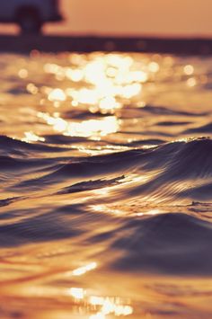 the sun shines brightly on the water as it reflects off the surface of the ocean