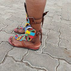 This a pair of brown leather gladiator sandals, they are beaded using multicolor fine beads. They are great gifts for friends and family, they are available in all sizes and are newly made after order in your perfect size. They are great summer shoes and can be worn to the beach and other outdoor activities and functions. They are comfortable and light, they are easy to walk in. The sandals are fully handmade with lots of love . Contact me for any customization and questions. We offer fast dhl s Handmade Brown Sandals With Ankle Strap, Brown Bohemian Flat Heel Sandals, Brown Bohemian Flat Sandals, Handmade Brown Sandals With Flat Heel, Bohemian Brown Sandals With Ankle Strap, Brown Bohemian Sandals With Ankle Strap, Bohemian Brown Ankle Strap Sandals, Brown Ankle Strap Barefoot Sandals For Festivals, Bohemian Brown Barefoot Sandals With Ankle Strap