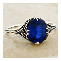 Vintage Estate 925 Solid Sterling Silver Solitaire Filigree Ring. The Top Of The Ring Measures 3/8 Inches In Length. The Setting Is Set With One High Quality 9x7 mm Royal Blue Lab-Created Sapphire Stone. Stamped 925.  Excellent Condition/Like New. Purple Dinosaur, Sapphire Solitaire, Sterling Silver Filigree, Filigree Ring, Sapphire Stone, True Blue, Gems Jewelry, Silver Filigree, Silver Blue