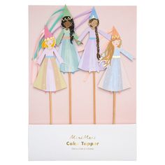 three paper dolls on top of wooden sticks with the words happy new year's cake topper