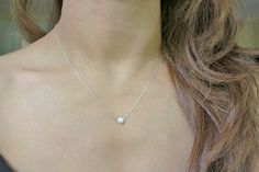 "Dainty, minimalist, layering, necklace or choker for everyday use. Design: FWP Chocker or Necklace Metal: Sterling Silver Stone: Button Freshwater Pearl Chain Style: Swage FWP Diameter: 6 mm Available Lengths: 14\", 15\", 16\", 17\", 18\", 19 Please take note that 14\", 15\" and 19\" are not standard lengths and will be customized as requested. Therefore, it is not returnable. Any stones and pearls are naturally imperfect. ------------------------------------------------------------------------ Simple Pearl Necklace As Gift, Minimalist Everyday Pearl Choker Necklace, Elegant Tiny Necklaces For Everyday, Simple Pearl Chain Necklace, Simple Pearl Charm Necklace, Simple Silver Jewelry With Pearl Charm, Elegant Tiny White Necklace, Simple Everyday Pearl Necklace With Clavicle Chain, Simple Everyday Pearl Clavicle Necklace