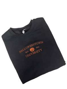 Halloweentown University Embroidered Unisex Crewneck Sweatshirt. Customize your item with your choice of shirt color and thread color. Primary Color option is the shirt.   No returns or exchanges on customized items. Please contact me at any time for concerns about your purchase. Fall College T-shirt With Embroidered Graphics, Fall College Embroidered T-shirt, Black Embroidered T-shirt For Fall, Embroidered Fall College T-shirt, Fall College Top With Embroidered Graphics, Embroidered Fall College Top, Embroidered Graphics T-shirt For College In Fall, Embroidered Graphic Tops For College In Fall, Embroidered Tops For College In Fall