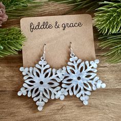 Fiddle and Grace is proud to offer affordable, lightweight super cute earrings! Need something to add to all your festive Christmas outfits? This pair of adorable, lightweight earrings is the perfect touch! They measure 1.6" wide x 1.8" tall and 1/8 inch thick.  The ones in the listing photo are made of White Marble Acrylic.  They are custom laser cut with a Classic Silver Nickel Free French Hook Ball Earwire and Antique Bronze Jump Rings. One of the reasons I love working with acylic is that ea Festive White Earrings For Winter, White Festive Earrings For Winter, White Winter Party Jewelry, White Jewelry For Winter Holiday, White Earrings For Festive Holiday Season, White Christmas Festive Earrings, White Festive Christmas Earrings, White Snowflake Jewelry For Holidays, Festive White Earrings For Christmas