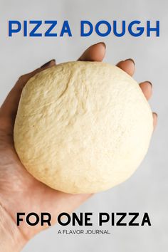 a person holding a piece of pizza dough in their hand with the words for one pizza on it