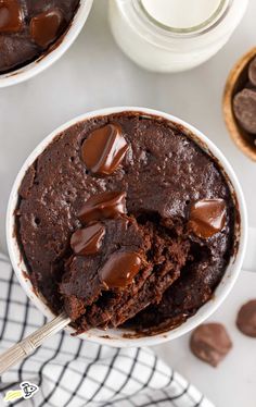 two bowls filled with brownie pudding and chocolate chips