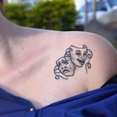 a woman with a tattoo on her shoulder