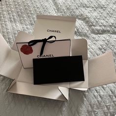 Flower Detail On One Side Of Bag Chanel Gift Bag - Black And White With Tie Closure Closed: 8.5" X 3" 5.5" Receipt Envelope - Black 8.5" X 4" Shipping Box Approx. 9" X 6" X 3" Location: B2 Receipt Envelope, Chanel Gift Bag, Flower Envelope, Chanel Glasses, Chanel #1, Edge Scarf, Chanel White, Chanel Camellia, Bag Chanel