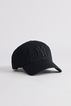 Cotton baseball cap by '47 Brand. Structured 6-panel fabrication and topped with a New York Yankees logo to the front. Includes an adjustable closure at the back and finished with a curved brim. Features '47 Brand New York Yankees MLB classic clean up hat Paneled cotton cap New York Yankees logo embroidery Adjustable strap closure Content + Care 100% Cotton Spot clean Imported Size + Fit Adjustable circumference | '47 Brand MLB New York Yankees Classic Clean Up Hat in Pitch black, Men's at Urban Outfitters Baseball Cap Boy, New York Yankee Hat, New York Yankees Logo, Yankees Cap, Yankees Hat, Mens Hats Baseball, Xmas Wishlist, Yankees Logo, Black Clothes