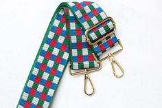 Adjustable multicolored (green, red, blue and white) checkered print purse strap . Pair this with your favorite crossbody messenger bag, purse, tote bag or handbag. This strap is also the perfect addition for game day or to show off your school spirit. 👜 Strap Details: - Adjustable length 30 - 54 inches (including clasps) - 2 inches wide - GOLD hardware - Design is shown on both sides of the strap Check out our other colors in this design 👇  https://www.etsy.com/shop/ShopAvalee?section_id=42113202 📦 Fast Shipping daily Mon-Fri Plaid Rectangular Shoulder Bag With Adjustable Strap, Green Rectangular Shoulder Bag With Adjustable Straps, Green Adjustable Rectangular Bag Strap, Printed Purse, Crossbody Messenger Bag, Purse Strap, Guitar Strap, Bag Straps, Purses Crossbody