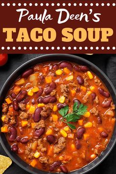 a bowl filled with chili and beans next to tortilla chips