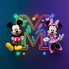 mickey and minnie mouse standing next to each other in front of a neon m sign