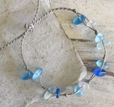 Channel your inner mermaid with this gorgeous beach bracelet or anklet made with mixed blues and white sea glass pebbles on our durable hand spun rope cord. Pure island style! Easy and secure adjustable slide knot closure allows for easy on and off. This bracelet/anklet is completely waterproof and metal free making it perfect for anyone with skin sensitivities and is a wonderful and unique gift for those hard to shop for friends and family on your list, especially the beach lovers! Color: Mixed Handmade Adjustable Sea Glass Bracelets, Beaded Sea Glass Jewelry For Beach, Beach Beaded Sea Glass Jewelry, Beach Jewelry With Hand Wrapped Sea Glass, Adjustable Recycled Glass Beaded Bracelets For Beach, Hand Wrapped Sea Glass Jewelry For The Beach, Hand-wrapped Sea Glass Jewelry For The Beach, Adjustable Ocean-inspired Sea Glass Jewelry, Ocean-inspired Recycled Glass Beach Jewelry