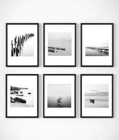 six black and white photographs hanging on the wall in front of a white wall with four different frames