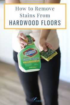 a woman is cleaning her hardwood floors with the words how to remove stains from hardwood floors