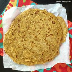 three tortillas sitting on top of a paper towel