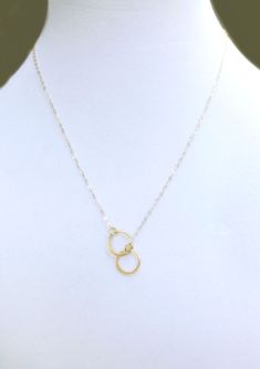 "Infinity Circle Lariat Necklace - Available in Gold, Rose Gold or 100% Sterling Silver A simple and dainty necklace ~ So simple & pretty! - 24k gold vermeil or sterling silver small circles measure about 12mm - Dainty circles attach to a shimmery 14k gold fill, sterling silver or rose gold fill chain - Total necklace length including circles is shown at 19\" - Model has size small neck - Please see measuring instructions to get the right length for you - Necklace closes with a 14k gold fill Minimalist Infinity Clavicle Chain Necklace, Minimalist Infinity Necklace With Delicate Chain, Dainty Infinity Necklace With Delicate Chain, Everyday Infinity Necklace With Adjustable Chain, Simple Necklace For Bridesmaid Gift, Simple Wedding Charm Necklace, Minimalist Charm Necklace For Wedding, Minimalist Infinity Necklace For Everyday, Minimalist Jewelry For Bridesmaids