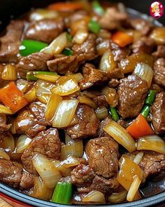 beef and onions stir fry in a skillet