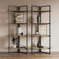 an empty room with some shelves and vases on the floor in front of it