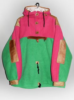 Vintage Buff Muff Polar System Activewear by Malden aztec tribal hooded fleece jacket from the 90's, made in USA  in neon pink and green with leather details. - Size tag: Please always check measurements before buying. Men's L - Measurements (laying flat): Pit to Pit: 28.5" Length: 31.5" Sleeve: 25" Pit to Cuff: 21.5" Across the shoulders: 24" -Wear: /Please see images for details/ Good vintage condition. The front pocket's button is missing and there is a rip on the inside lining as shown on th Pink Hooded Winter Jacket For Outdoor Activities, Green Fleece Jacket For Winter Streetwear, Pink Fleece-lined Outerwear For Streetwear, Green Winter Fleece Jacket For Streetwear, Green Winter Fleece Jacket With Fleece Lining, Winter Green Fleece Jacket With Fleece Lining, Hooded Green Fleece Jacket With Fleece Lining, Pink Fleece Jacket With Pockets For Outdoor, Pink Fleece Jacket For Outdoor Activities