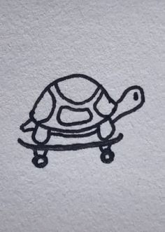 a drawing of a turtle is shown on a white paper sheet that has black ink