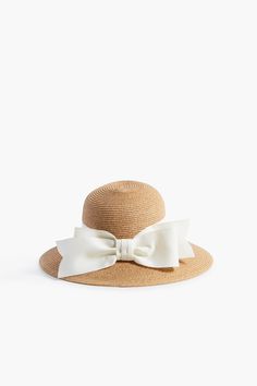 Exclusive Cream Packable Wide Bow Sunhat | Toucan Hats Chic Sun Hat With Bow For Vacation, Chic Sun Hat With Bow For Kentucky Derby, Chic Vacation Sun Hat With Bow, Chic Straw Hat With Bow For Vacation, Adjustable Bow Boater Hat For Kentucky Derby, Chic Vacation Straw Hat With Bow, Adjustable Boater Hat With Bow For Kentucky Derby, Chic Packable Straw Hat For Vacation, Chic Packable Beach Hats