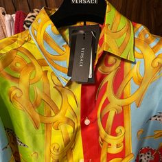 Beautiful Versace Shirt, Very Soft Silk Material, 100% Authentic,, Willing To Negotiate On The Listing Price, Willing To Trade For An Authentic Louis Vuitton Monogram Keepall 55 Or 60 Luggage Bag!!! Designer Multicolor Print Shirt For Spring, Multicolor Printed Silk Shirt, Designer Multicolor Long Sleeve Shirt, Designer Multicolor Printed Shirt, Designer Multicolor Silk Shirt, Designer Multicolor Graphic Print Blouse, Designer Multicolor Print Tops For Spring, Designer Short Sleeve Multicolor Shirt, Designer Multicolor Long Sleeve Top