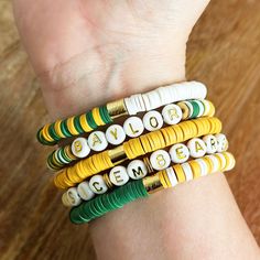 Cheer on the Baylor Bears with this special Baylor Bears Bracelet Set! Perfect for any Baylor-loving fan, these five handmade bracelets are sure to show your spirit and passion for Waco and BU. Let everyone know where your heart is with this festive bracelet set. Each bracelet is stretchy and comfortable, giving you inspiration to always keep the Bears close to your heart! From gameday days to lazy Sundays at home - whenever you don both Spirits of Waco bracelets, you'll be reminded of what an a Leo Club, Heishi Jewelry, Stacked Beaded Bracelets, Baylor Bear, Beads Bracelet Design, Bracelets Diy, Gold Bead Bracelets, Bracelet Design, Beaded Bracelets Diy