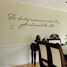 the dining room wall decal is shown in black and white, with a quote on it