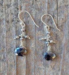 This product is made of metal alloy (silver and copper and other metal alloys) with high- quality plating (It will last for a long time without tarnish). Handmade with love in Sausalito, California. | A Blonde and Her Bag Black Spinel Drop Earrings with Pyrite Accent Beads. Silver dangle earrings with pyrite accent beads and a black spinel drop. Size: 8" Length Hypoallergenic. | 1-800-Flowers Gifts Delivery Black Spinel Drop Earrings W/ Pyrite Accent Beads Artisan Silver Earrings With Silver Beads, Artisan Faceted Silver Jewelry, Adjustable Faceted Silver Earrings, Artisan Silver Faceted Jewelry, Silver Bead Artisan Earrings, Artisan Silver Earrings With Round Beads, Artisan Dangle Earrings With Black Beads, Artisan Black Beaded Dangling Earrings, Artisan Black Bead Dangle Earrings