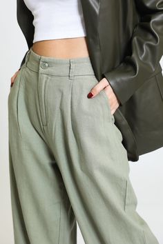 Step into effortless elegance with our Pleated Wide Leg Trouser in Sage Leaf. These trousers are designed to elevate your wardrobe with their chic and comfortable fit, making them an essential addition for any fashion-forward individual. Key Features: Fabric Contents: Crafted from a luxurious blend of 55% Linen and 45% Rayon, these trousers offer breathability and softness, ensuring you stay comfortable throughout the day. Stylish Design: The pleated wide leg silhouette not only flatters your fi Sage Leaf, Skirt Crop, Effortless Elegance, Tops For Leggings, Cropped Jeans, Jogger Pants, Stylish Design, Short Tops, Flare Jeans